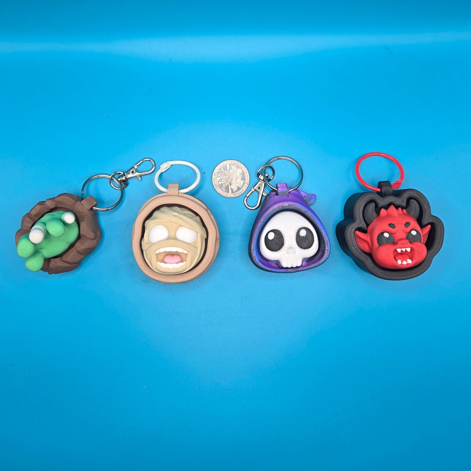 Collection of colorful keychains on a blue surface